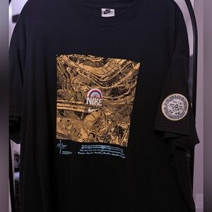 Nike Black and Gold Graphic Tee
